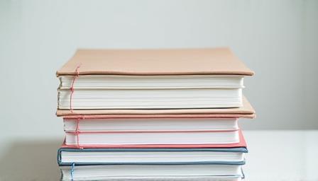 Stack of paper and notebooks